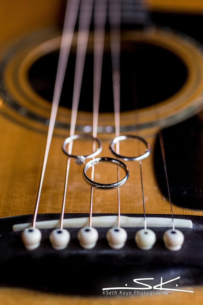 wedding rings on a guitar