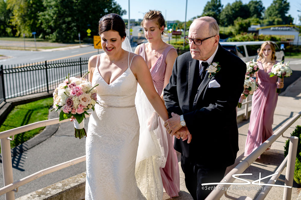 bride entering the church with her father